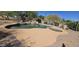 Desert backyard with a sparkling pool and patio area surrounded by lush greenery, creating a private oasis at 2926 W Tanya Trl, Phoenix, AZ 85086