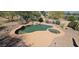 This desert backyard features a refreshing pool, lush landscaping, and plenty of room for outdoor activities at 2926 W Tanya Trl, Phoenix, AZ 85086