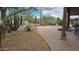 Outdoor pool surrounded by desert landscaping, brick pavers, and shaded seating area at 2926 W Tanya Trl, Phoenix, AZ 85086