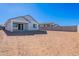 Large backyard with sandy ground and block wall at 40000 W Bunker Dr, Maricopa, AZ 85138