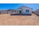 Large backyard with sandy ground and block wall at 40000 W Bunker Dr, Maricopa, AZ 85138