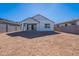 Large backyard with sandy ground and block wall at 40000 W Bunker Dr, Maricopa, AZ 85138