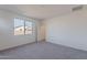 Bright bedroom with window and carpet flooring at 40000 W Bunker Dr, Maricopa, AZ 85138