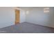 Spacious bedroom with carpet flooring and en-suite bathroom at 40000 W Bunker Dr, Maricopa, AZ 85138