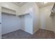 Spacious walk-in closet with double hanging rods at 40000 W Bunker Dr, Maricopa, AZ 85138