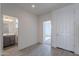 Bright entryway with tile flooring and powder room at 40000 W Bunker Dr, Maricopa, AZ 85138
