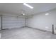 Spacious garage with overhead door and ample storage space at 40000 W Bunker Dr, Maricopa, AZ 85138