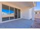 Covered patio with sliding glass doors leading to backyard at 40000 W Bunker Dr, Maricopa, AZ 85138