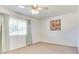 Bright bedroom featuring natural light, neutral walls, and soft curtains, creating a peaceful retreat at 9902 W Sandstone Dr, Sun City, AZ 85351