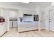 Bright kitchen with tile flooring, appliances, and ample cabinet space at 9902 W Sandstone Dr, Sun City, AZ 85351