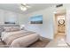 Serene main bedroom featuring neutral tones and an en-suite bathroom at 9902 W Sandstone Dr, Sun City, AZ 85351