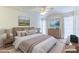 Serene bedroom retreat with a comfortable bed, soft lighting, and elegant decor, creating a relaxing atmosphere at 9902 W Sandstone Dr, Sun City, AZ 85351