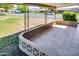 Covered outdoor patio with views of the community and nearby street at 9902 W Sandstone Dr, Sun City, AZ 85351