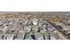 An aerial view showing a modern residential community, highlighting single Gathering homes and a great location at 10155 E Toledo Ave, Mesa, AZ 85212