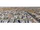 Real estate aerial view showcases a dense neighborhood with uniformly styled single-Gathering homes at 10155 E Toledo Ave, Mesa, AZ 85212