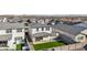 Aerial view of a home's backyard with artificial turf, neutral-toned exteriors, and a clean, modern outdoor space at 10155 E Toledo Ave, Mesa, AZ 85212