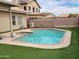 Beautiful backyard pool and spa surrounded by artificial grass for easy care at 11519 W Clover Way, Avondale, AZ 85392