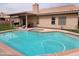 Refreshing backyard pool with attached spa, perfect for relaxing and entertaining at 11519 W Clover Way, Avondale, AZ 85392