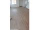 Spacious living room with wood-look tile flooring at 15595 S 181St Dr, Goodyear, AZ 85338