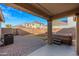 Covered patio, hot tub, and spacious grassy area at 1724 S Rockwell St, Gilbert, AZ 85295