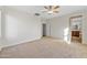 Spacious bedroom with carpet and ceiling fan at 1724 S Rockwell St, Gilbert, AZ 85295