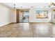 Dining room with tile floors and sliding glass doors to backyard at 1724 S Rockwell St, Gilbert, AZ 85295