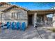 Inviting front entry with four blue chairs on a brick patio at 1724 S Rockwell St, Gilbert, AZ 85295