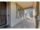 Covered porch with wood flooring and a view of the yard at 1724 S Rockwell St, Gilbert, AZ 85295