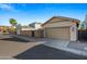 Attached two-car garage with tan doors at 1724 S Rockwell St, Gilbert, AZ 85295