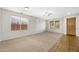 Bright living room with neutral carpet and tile flooring at 1724 S Rockwell St, Gilbert, AZ 85295