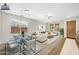 Virtually staged living and dining area with modern furniture at 1724 S Rockwell St, Gilbert, AZ 85295