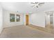 Spacious living room featuring tile and carpeted floors at 1724 S Rockwell St, Gilbert, AZ 85295