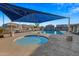 Relaxing community pool with a spa and shade structures at 1724 S Rockwell St, Gilbert, AZ 85295