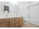 Modern bathroom featuring dual sinks, vanity and shower with tub at 1296 E Coconino Way, Gilbert, AZ 85298