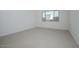 Bright bedroom with carpet and a large window at 1296 E Coconino Way, Gilbert, AZ 85298