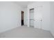 Bright bedroom featuring neutral carpeting and a closet with sliding doors at 1296 E Coconino Way, Gilbert, AZ 85298