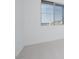 Bright bedroom showcasing a large window and neutral carpeting at 1296 E Coconino Way, Gilbert, AZ 85298