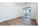 Cozy bedroom with a sliding glass door and private outdoor access at 1296 E Coconino Way, Gilbert, AZ 85298