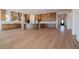 Spacious kitchen with stainless steel appliances, a large center island, and wood-look flooring at 1296 E Coconino Way, Gilbert, AZ 85298