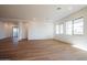 Bright living room features hardwood floors and multiple windows for natural light at 1296 E Coconino Way, Gilbert, AZ 85298