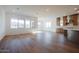 Open-concept living space with large windows, hardwood floors, and abundant natural light at 1296 E Coconino Way, Gilbert, AZ 85298