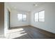 Minimalist living room with abundant natural light from large windows and sliding door at 1296 E Coconino Way, Gilbert, AZ 85298