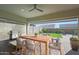 Inviting covered patio with dining set and grill, perfect for outdoor entertaining at 17917 W Amberwood Dr, Goodyear, AZ 85338