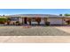 Ranch-style home with landscaped yard and attached garage at 9409 W Glen Oaks N Cir, Sun City, AZ 85351