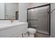 Bathroom includes a glass shower, new toilet, and vanity at 1284 E Coconino Way, Gilbert, AZ 85298