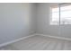 Bedroom boasts natural light, neutral paint, and carpet at 1284 E Coconino Way, Gilbert, AZ 85298