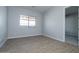 Bedroom with neutral walls and wood-look flooring and a window at 1284 E Coconino Way, Gilbert, AZ 85298