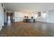 Spacious kitchen with white cabinets, a large island, stainless steel appliances, and wood-look tile flooring at 1284 E Coconino Way, Gilbert, AZ 85298