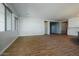 Open-concept living room with wood-look tile floors and plenty of natural light at 1284 E Coconino Way, Gilbert, AZ 85298