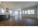 Spacious living room with wood-look tile flooring and large windows providing ample natural light at 1284 E Coconino Way, Gilbert, AZ 85298